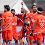 Indian hockey players celebrate the gold medal win over Malaysia