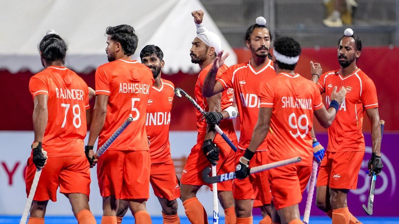 Indian hockey players celebrate the gold medal win over Malaysia